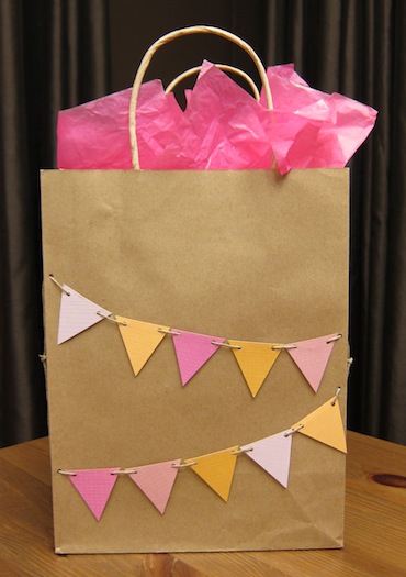 Impromptu decoration of a plain gift bag using scrap paper